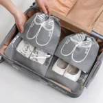 kf-Se1ae6dddfa904ae6a948551b05dced35a-Reusable-Non-woven-Shoes-Storage-Organizer-Bags-Travel-Portable-Closet-Bag-Waterproof-Pocket-Clothing-Tranparent-Hanging
