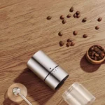 kf-S50398fb1fa204a09b5eb9e4f85ab2e5e1-Hand-Cranked-Bean-Grinder-304-Stainless-Steel-Mold-Core-Coffee-Grinder-Plastic-Stainless-Steel-Spray-Painted