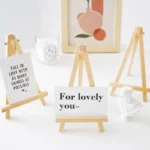 kf-S2cda3be7c32f4a39ad87aa4ae82d55e7a-1pcs-Natural-Wood-Mini-Easel-Frame-Tripod-Display-Meeting-Wedding-Table-Name-Card-Stand-Display-Holder