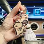 kf-S7db859eb7f1c4b5abb592a6b662b35e02-YONEX-Cartoon-Badminton-Bag-Keychain-Fashionable-Cute-Tennis-Racket-Backpack-Keychain-Acrylic-Pendant-Couple-s-Gift