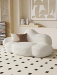 kf-Sfa88d742d0504973a8b69cae13a82f65K-Nordic-designer-cloud-sofa-lambskin-arc-hotel-beauty-salon-homestay-fabric-special-shaped-wabi-sabi-style